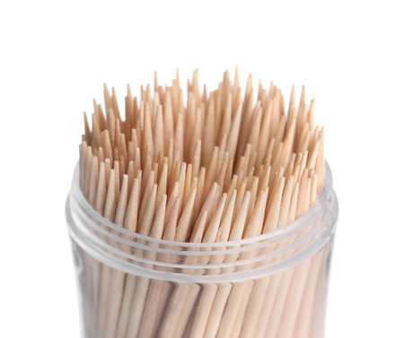 Wooden toothpicks in holder on white background, closeupの写真素材