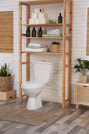Stylish bathroom interior with toilet bowl and other essentialsの写真素材