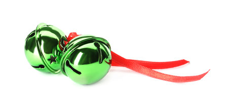 Shiny green sleigh bells with ribbon isolated on whiteの写真素材