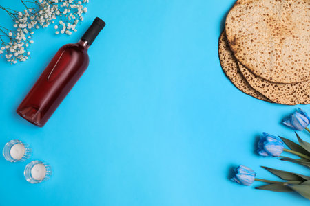 Flat lay composition with matzos on light blue background, space for text. Passover (Pesach) celebrationの写真素材
