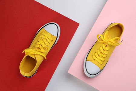 Stylish sneakers on color background, flat layの写真素材
