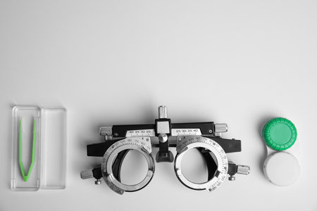 Different ophthalmologist tools on white background, flat layの写真素材