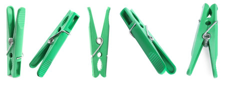 Set with green plastic clothes pins on white background. banner designの写真素材