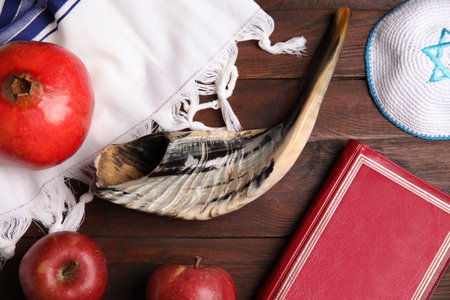 Flat lay composition with Rosh Hashanah holiday symbols on wooden tableの写真素材