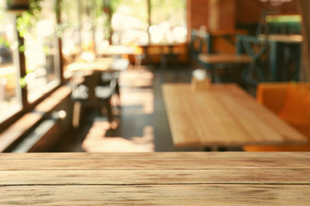 Empty wooden table in cafe. bokeh effectの写真素材