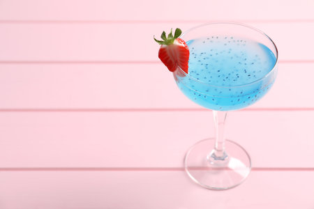 Tasty light blue cocktail on pink wooden table, space for textの写真素材