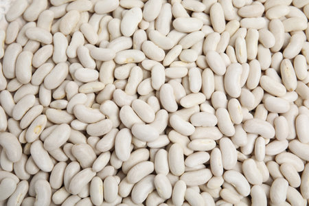 Heap of raw beans as background, top view. Veggie seeds