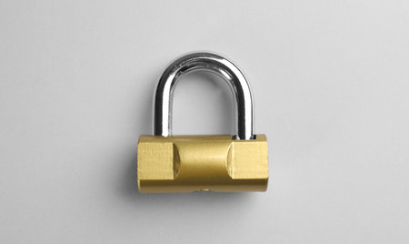 Modern padlock on light background, top viewの写真素材