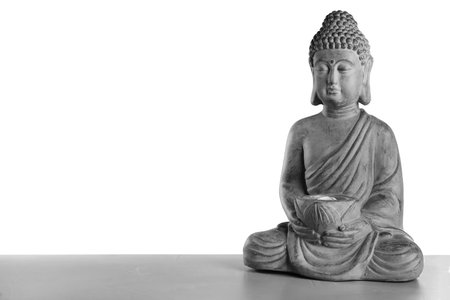 Beautiful stone Buddha sculpture on table against gray background. Space for textの写真素材
