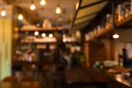 Blurred view of stylish modern cafe interior with bokeh effectの写真素材