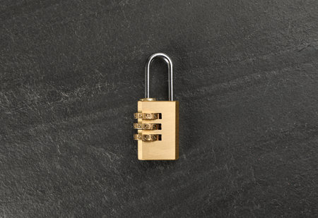 Modern combination lock on black table, top viewの写真素材