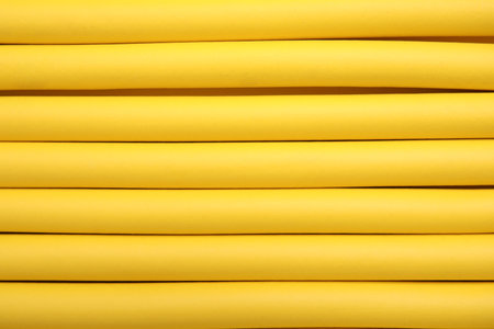 Curling rods as background, closeup. hair styling toolの写真素材