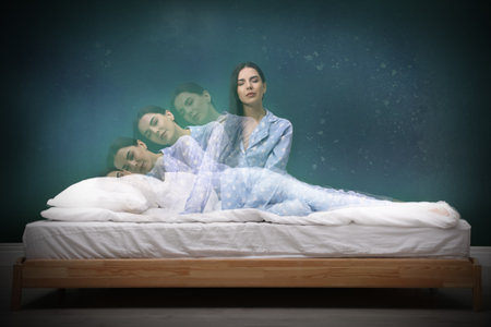 Somnambulist rising from bed near dark wall indoors, multiple exposure. sleepwalkingの写真素材