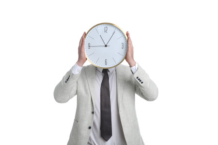 Businessman holding clock on white background. time managementの写真素材