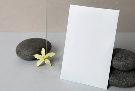 Scented sachet, spa stones and flower on gray tableの写真素材
