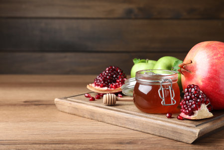Honey, pomegranate and apples on wooden table. Rosh Hashanah holidayの写真素材