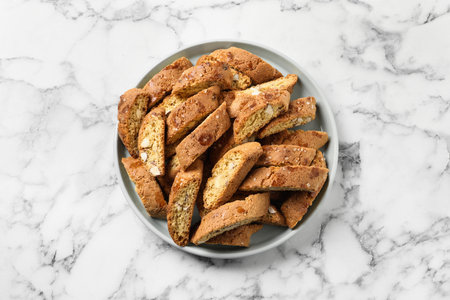 Traditional Italian almond biscuits (Cantucci) on white marble table, top viewの写真素材