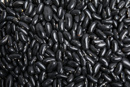 Heap of black beans as background, top view. Veggie seedsの写真素材