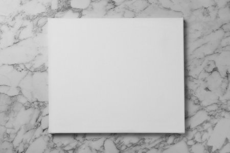 Blank canvas on white marble background, space for textの写真素材