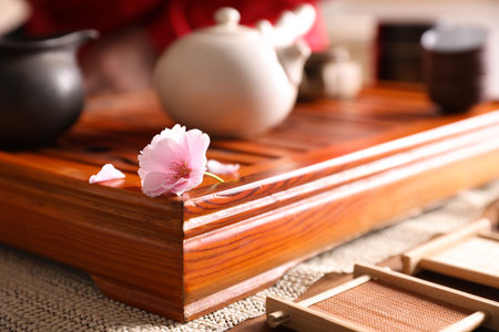 Tray for traditional tea ceremony with sakura flower on table, closeupの写真素材