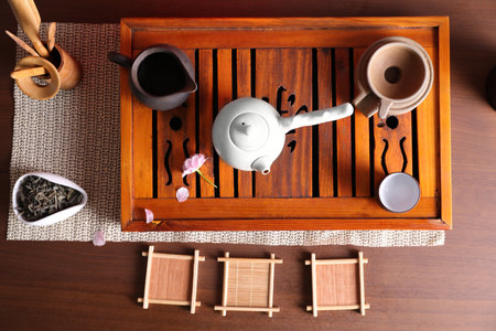 Beautiful set for traditional tea ceremony on wooden table, flat layの写真素材