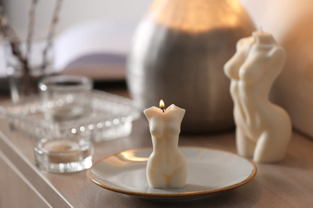 Beautiful body shaped candles on table indoorsの写真素材