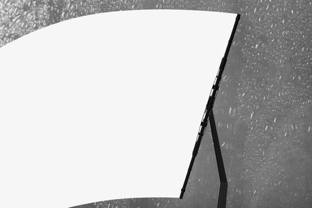 Car windshield wiper cleaning water drops from glassの写真素材