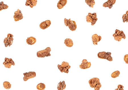 Delicious granola falling on white background. Healthy snackの写真素材