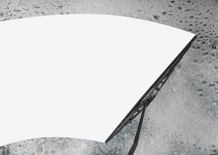Car windshield wiper cleaning water drops from glassの写真素材