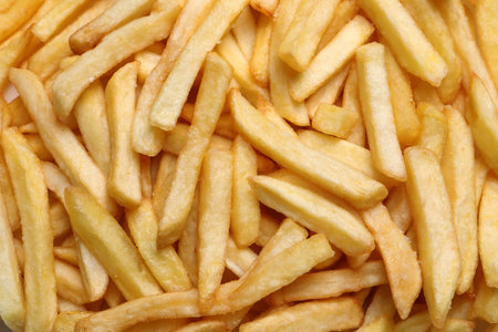 Yummy French fries as background, top viewの写真素材