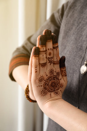 Woman with henna tattoo on hand, closeup. traditional mehndi ornamentの写真素材