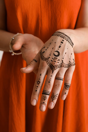 Woman with henna tattoo on hand, closeup. traditional mehndi ornamentの写真素材