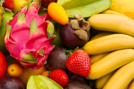 Assortment of fresh exotic fruits as background, top viewの写真素材