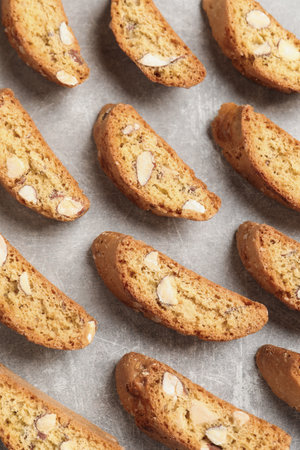 Traditional Italian almond biscuits (Cantucci) on light table, flat layの写真素材