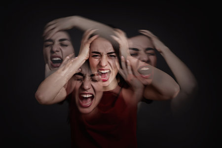 Woman with personality disorder on dark background, multiple exposureの写真素材