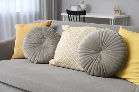Comfortable sofa with pillows in living room, closeup. interior designの写真素材