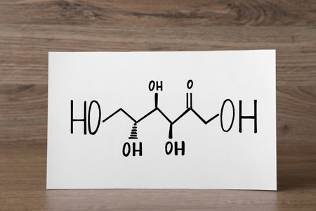 Paper sheet with drawn scheme on wooden tableの写真素材