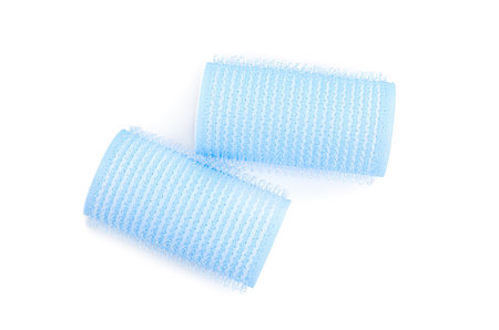Hair curlers isolated on white, top view. Styling toolの写真素材