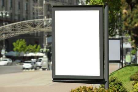 Blank advertising board on city street. Mockup for designの写真素材