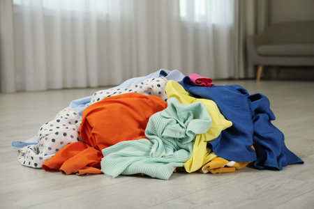 Pile of dirty clothes on floor indoorsの写真素材