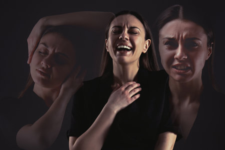 Woman with personality disorder on dark background, multiple exposureの写真素材
