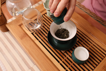 Master conducting traditional tea ceremony at table, closeupの写真素材