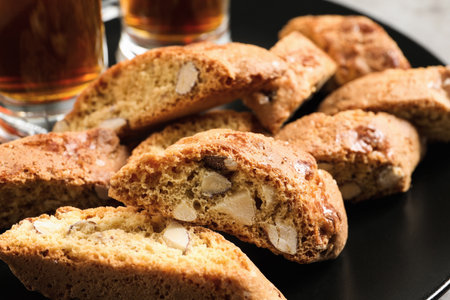 Slices of tasty cantucci on plate, closeup. Traditional Italian almond biscuitsの写真素材