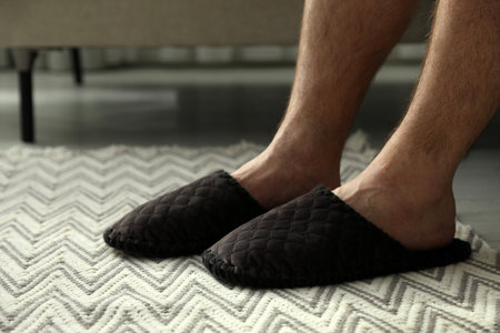 Man in soft slippers at home, closeupの写真素材