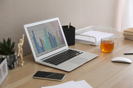 Stylish workplace with laptop on wooden desk. interior designの写真素材