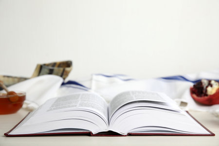 Open Torah on white wooden table, space for text. Rosh Hashanah celebrationの写真素材