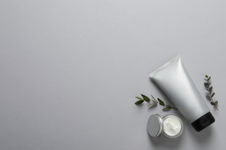 Tube of men's facial cream on light gray background, flat lay. Space for textの写真素材