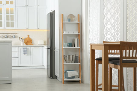 Decorative wooden ladder in stylish kitchen. interior design