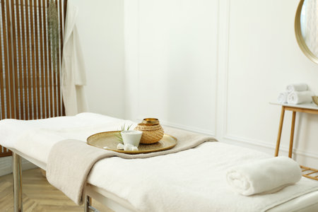Stylish room interior with massage table in spa salonの写真素材