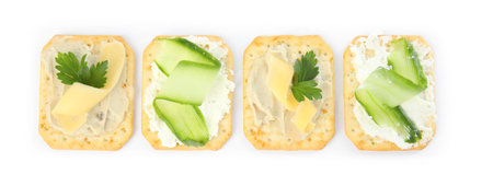 Delicious crackers with humus and cheese on white background, top viewの写真素材